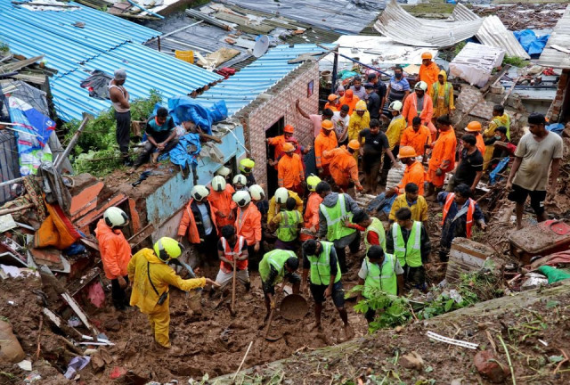 rescue workers search for survivors after a residential house collapsed due to landslide caused by heavy rainfall in mumbai india july 18 2021 reuters niharika kulkarni rescue workers search for survivors after a residential house collapsed due to landslide caused by heavy rainfall in mumbai india july 18 2021 reuters niharika kulkarni