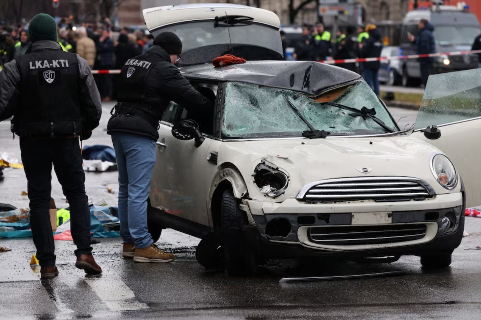 police work at a car which drove into a crowd in munich germany february 13 2025 injuring several people photo reuters