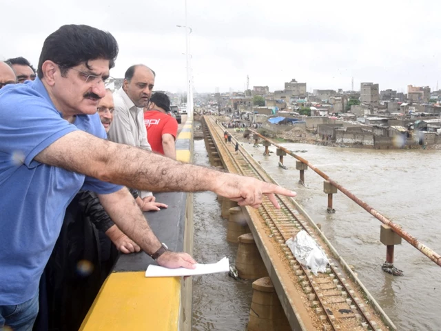 sindh chief minister syed murad ali shah accompanied by provincial ministers inspects the lyari river flowing at peak levels near the machhar colony section of the lyari expressway on sep 10 2025 photo express