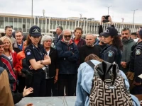 police officers watch members of the global sumud flotilla vessels intercepted by the israeli navy in international waters demonstrating in the town of ierapetra in the island of crete greece on may 1 2026 photo afp