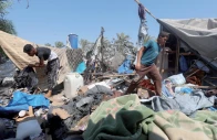 ruined shelter palestinians inspect the site of an israeli strike on a tent in khan younis southern gaza strip photo reuters