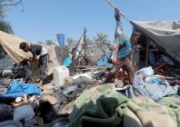 ruined shelter palestinians inspect the site of an israeli strike on a tent in khan younis southern gaza strip photo reuters