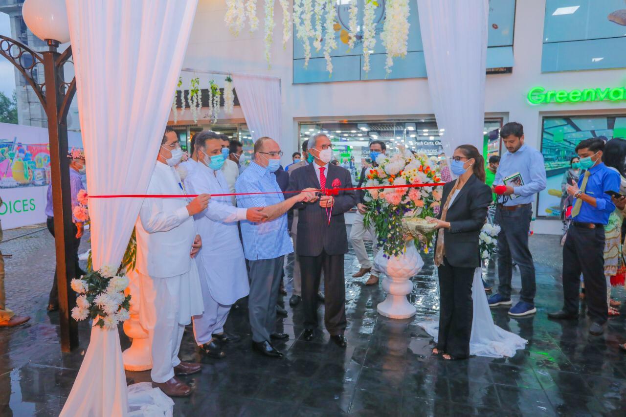 malik riaz inaugurates greenvalley supermarket branch