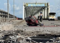 a damaged motorcycle sits on the kisapanadi bridge following a military airstrike on a market and the bridge in kyauktaw western rakhine state myanmar sept 28 2026 photo afp