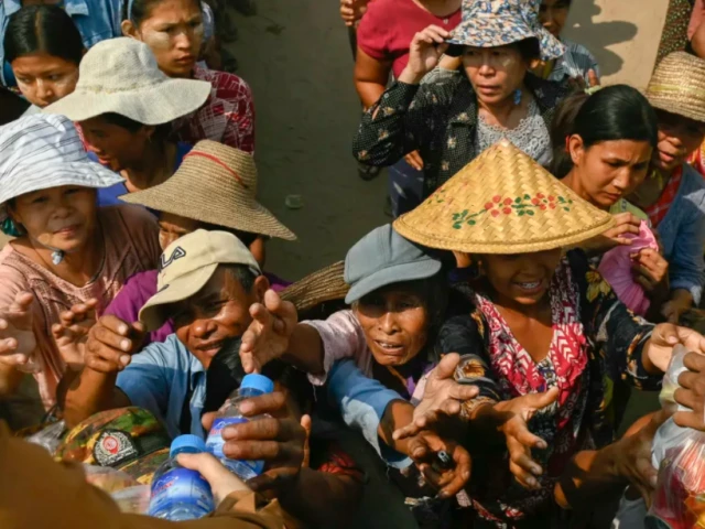 people reach up for food aid being distributed in sagaing on 3 april 2025 following the 28 march earthquake photo afp people reach up for food aid being distributed in sagaing on 3 april 2025 following the 28 march earthquake photo afp