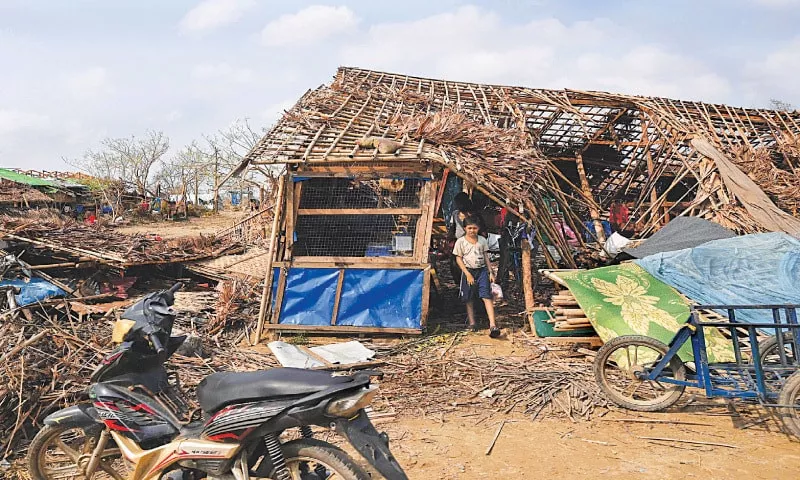 a boy walks out of a destroyed house at the ohn taw chay refugee camp on tuesday the destruction in the aftermath of cyclone mocha continues as death toll in the country rose to 81 according to local media photo afp a boy walks out of a destroyed house at the ohn taw chay refugee camp on tuesday the destruction in the aftermath of cyclone mocha continues as death toll in the country rose to 81 according to local media photo afp