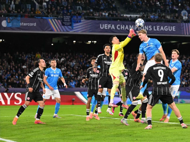 napoli s rasmus hojlund tries to score against frankfurt s goalkeeper michael zetterer during the uefa champions league match at the diego armando maradona stadium in naples photo afp