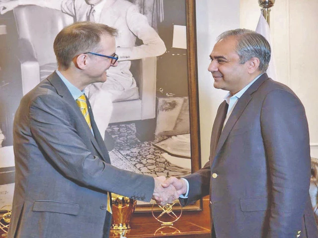 interior minister mohsin naqvi shakes hands with director general of the uk s nca graeme biggar in islamabad photo app