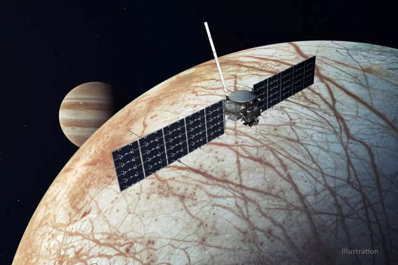 an illustration of nasa s europa clipper spacecraft flying near the icy moon with jupiter in the background photo nasa jpl caltech