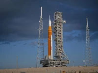 nasa s sls space launch system rocket and orion spacecraft secured to the mobile launcher are seen as they arrive at the launch pad 39b friday march 20 2026 at nasa s kennedy space center in florida photo nasa