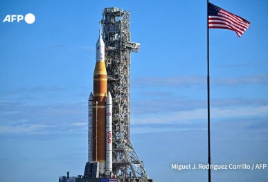 nasa on saturday rolled out its towering sls rocket and orion spacecraft photo afp