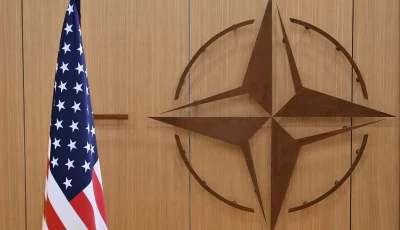this photo shows the logo of the north atlantic treaty organisation nato and the us flag at nato headquarters in brussels belgium on february 17 2025 photo reuters