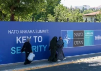 people walk past billboards built for upcoming nato summit in ankara turkey july 1 2026 reuters