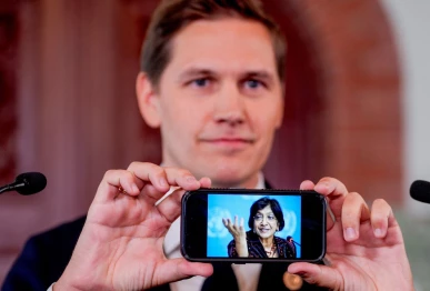 chair of the norwegian nobel committee jorgen watne frydnes shows a photo of navanethem navi pillay who was announced as the recipient of the 2026 nobel peace prize at the norwegian nobel institute in oslo norway october 9 2026 photo reuters