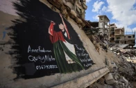 palestinians walk near a mural painted in honour of american rapper macklemore amid buildings destroyed during the war in gaza city september 18 2026 photo reuters