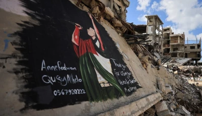 palestinians walk near a mural painted in honour of american rapper macklemore amid buildings destroyed during the war in gaza city september 18 2026 photo reuters