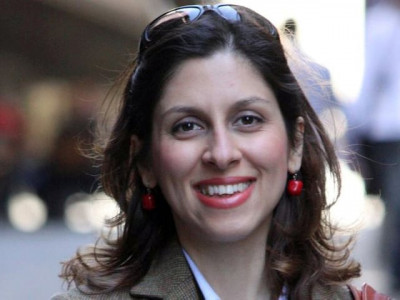 iran releases british iranian aid worker but court summons looms