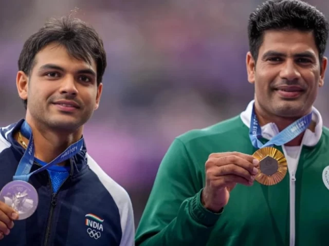 gold medallist arshad nadeem of pakistan celebrates with his medal on the podium with silver medallist neeraj chopra of india at stade de france on august 9 2024 photo reuters file gold medallist arshad nadeem of pakistan celebrates with his medal on the podium with silver medallist neeraj chopra of india at stade de france on august 9 2024 photo reuters file