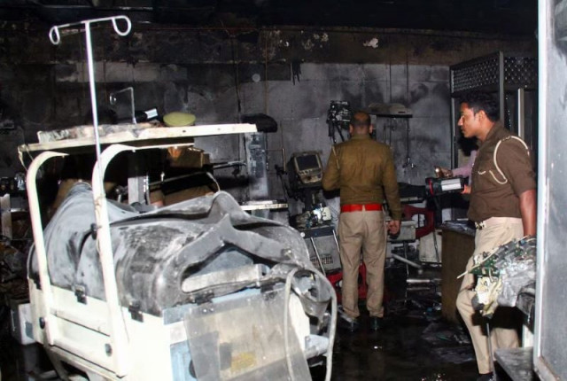 police officers examine the damaged neonatal intensive care unit after a fire broke out at the maharani laxmibai medical college in jhansi district in the northern state of uttar pradesh india november 16 2024 photo reuters police officers examine the damaged neonatal intensive care unit after a fire broke out at the maharani laxmibai medical college in jhansi district in the northern state of uttar pradesh india november 16 2024 photo reuters