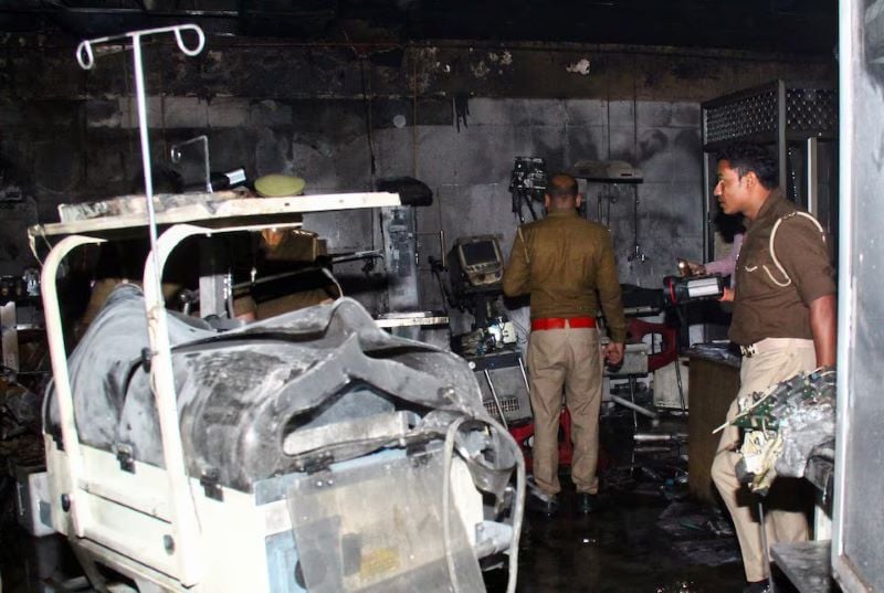 police officers examine the damaged neonatal intensive care unit after a fire broke out at the maharani laxmibai medical college in jhansi district in the northern state of uttar pradesh india november 16 2024 photo reuters