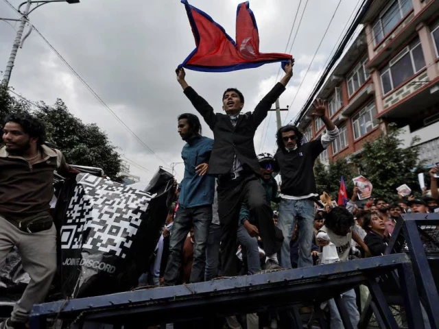 demonstrators shout slogans as they stand on a barricade during a protest against corruption and the government s decision to block several social media platforms in kathmandu nepal september 8 photo reuters demonstrators shout slogans as they stand on a barricade during a protest against corruption and the government s decision to block several social media platforms in kathmandu nepal september 8 photo reuters