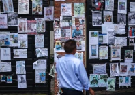 a man looks at a wall displaying photographs of missing people outside tribhuvan university teaching hospital following the deadly flash floods and mudslide in kathmandu nepal september 2 2026 photo reuters