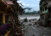 people stand next to damaged buildings following the deadly flash floods and a mudslide in devighat nuwakot district nepal september 4 2026 photo reuters