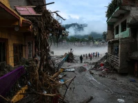 people stand next to damaged buildings following the deadly flash floods and a mudslide in devighat nuwakot district nepal september 4 2026 photo reuters