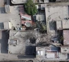 a screengrab from a drone video taken on september 2 shows damage to a courtyard and a hole in the roof of a home where a wedding ceremony was held screengrab reuters