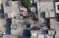 a screengrab from a drone video taken on september 2 shows damage to a courtyard and a hole in the roof of a home where a wedding ceremony was held screengrab reuters