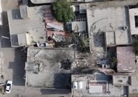 a screengrab from a drone video taken on september 2 shows damage to a courtyard and a hole in the roof of a home where a wedding ceremony was held screengrab reuters