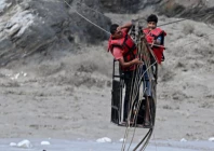 nepal flood survivors cling to zipline