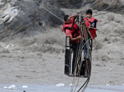 nepal flood survivors cling to zipline