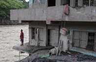 bhuban bahadur subedi 66 stands at his damaged house by the trishuli river following deadly flash floods and a mudslide in dhading district nepal september 14 2026 reuters