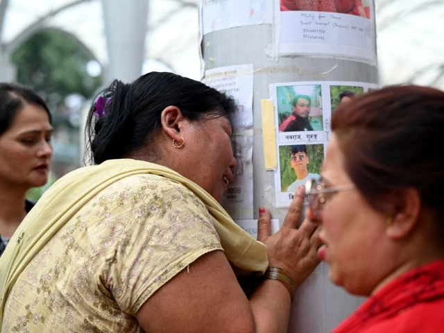 a woman whose son is missing reacts next to photographs of missing people pasted on a pillar outside tribhuvan university teaching hospital following flash floods and a mudslide in kathmandu nepal september 1 2026 reuters a woman whose son is missing reacts next to photographs of missing people pasted on a pillar outside tribhuvan university teaching hospital following flash floods and a mudslide in kathmandu nepal september 1 2026 reuters