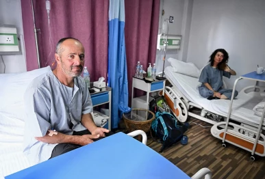 avalanche survivors france s didier armand berton l and isabelle thaon sit inside a ward at the era hospital in kathmandu on november 4 2025 photo afp