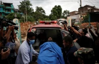 an injured man is rushed to a hospital after devastating floods near nepal china border photo reuters