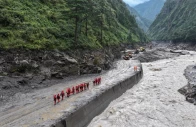 a drone view of firefighters conducting search and rescue operations at a damaged road leading to gyirong port after a mudslide in gyirong county shigatse tibet autonomous region china august 28 2026 photo reuters
