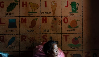 a woman displaced by the deadly flash floods and mudslide sits inside a classroom at a school turned into a temporary shelter in devighat nuwakot district nepal september 5 2026 photo reuters