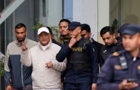 former nepal prime minister and chairman of the communist party of nepal kp sharma oli gestures while being taken to a hospital from the district police range after his detention by police in kathmandu nepal march 28 2026 photo reuters