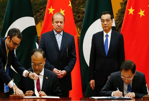 China's Premier Li Keqiang (back R) and Pakistan's Prime Minister Nawaz Sharif (back L) attend a signing ceremony at the Great Hall of the People in Beijing on May 13, 2017. PHOTO: AFP