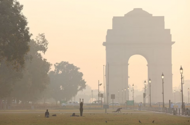people exercise on a grass lawn near india gate along kartavya path on a smoggy morning in new delhi india october 27 2023 reuters anushree fadnavis file photo acquire licensing rights