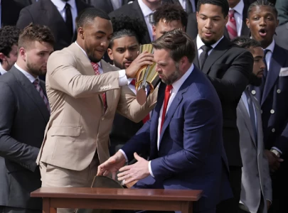 watch jd vance fumbles ohio state trophy gets trolled online