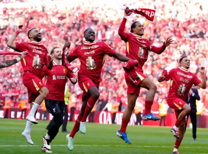 liverpool tie manchester united s record by winning premier league