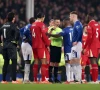 watch chaotic scenes at liverpool vs everton as fans invade the pitch