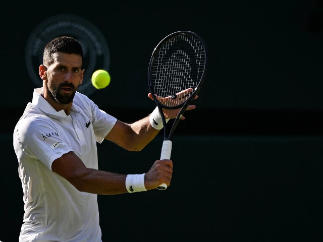 serbia s novak djokovic plays a backhand return to italy s jannik sinner during their men s singles semi final tennis match on the twelfth day of the 2025 wimbledon championships at the all england lawn tennis and croquet club in wimbledon southwest london on july 11 2025 photo afp