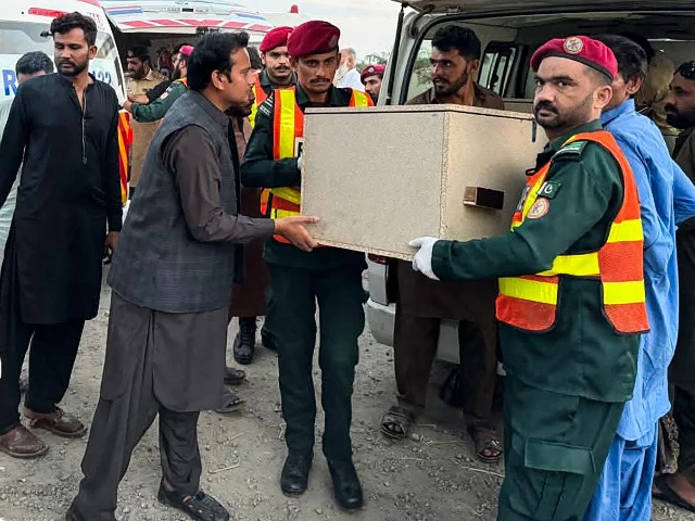 rescue personnel transfer the body of a bus passenger into an ambulance a day after he was killed in a militant attack at the zhob district in balochistan province on july 11 2025 photo afp