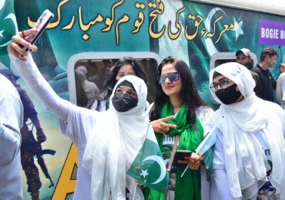 women passengers take selfie in front of the thar desert safari azadi train at the railway station travelling from karachi to khokhrapar as a part of the 78th day of independence and marka e haq celebrations photo app
