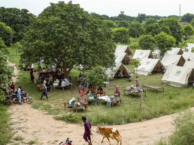 flood affected victims take shelter at a makeshift relief camp on the outskirts of multan punjab province on september 2 2025 photo afp flood affected victims take shelter at a makeshift relief camp on the outskirts of multan punjab province on september 2 2025 photo afp