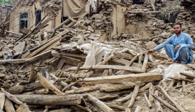 an afghan man sits amid the remains of a damaged house in the aftermath of an earthquake at the dara i nur district of nangarhar province on september 3 2025 photo afp